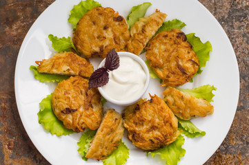 Potato pancakes for breakfast. Old rustic background. Top view. Close-up