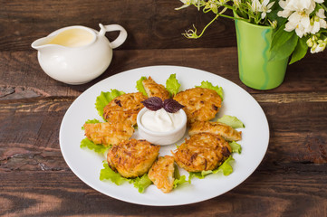 Potato pancakes for breakfast. Wooden rustic background. Top view. Close-up