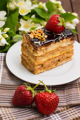 Fresh cream cake slice on a wooden table. Top view. Close-up