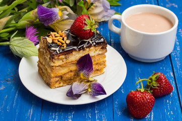 Fresh cream cake slice on a wooden table. Top view. Close-up