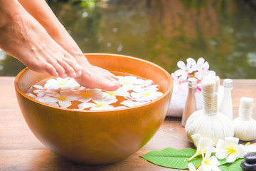 Spa massage compress balls, herbal ball on the wooden with tream