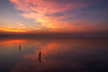 the photographer's traces, leaving on thin ice on the middle of the lake on a winter decline