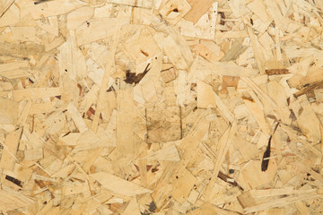 Close up of a recycled compressed wood chippings board.