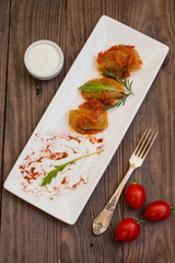 Stuffed cabbage with buckwheat. Old background. Top view. Close-up