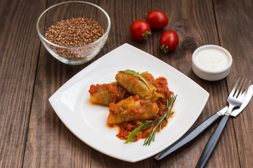 Stuffed cabbage with buckwheat. Old background. Top view. Close-up