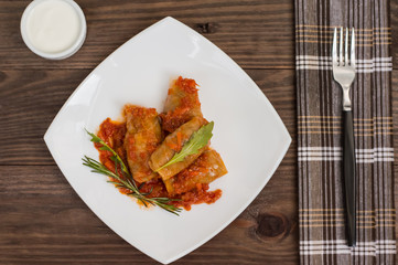 Stuffed cabbage with buckwheat. Old background. Top view. Close-up