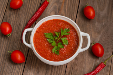 Gazpacho with vegetables. Wooden rustic background. Top view