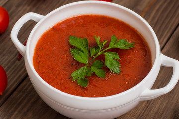 Gazpacho with vegetables. Wooden rustic background. Top view