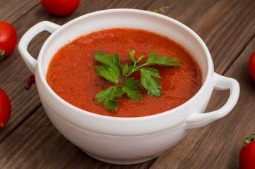 Gazpacho with vegetables. Wooden rustic background. Top view