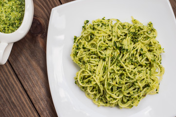 Pasta with pesto Brazilian. Wooden table. Top view