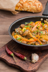 Meat in Burgundy in a frying pan