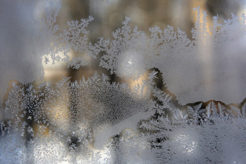 Obraz na płótnie Canvas ice patterns on frozen window