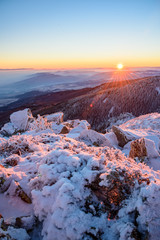 Beautiful frosty sunrise in the mountains - Vitosha, Bulgaria - the sun rising over the snowy...
