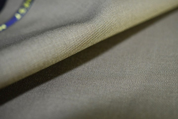 close up texture brown gold fabric of suit