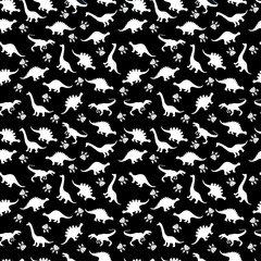 Cute kids pattern for girls and boys. Colorful dinosaurs on the abstract grunge background create a fun cartoon drawing. The background is executed in monochrome colors. For textile and fabric