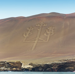 Ancient large-scale geoglyph Candelabrum figure in Paracas national park. It is a designated UNESCO World Heritage Site - Peru, South America