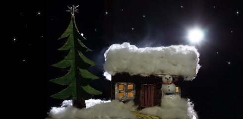 Christmas night craft: house and christmas tree made of cardboard