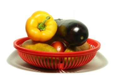 vegetables in a red basket
