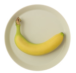 Gelbe perfekte Banane auf weissem Teller