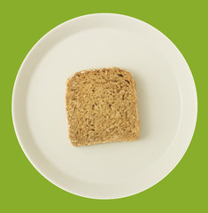 Diätkonzept - Abnehmen durch Verzicht - Einzelne Brotscheibe auf Teller