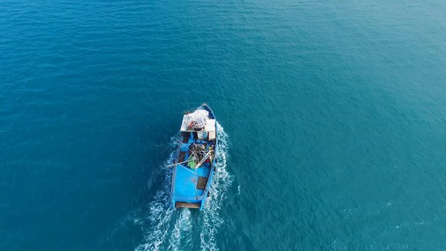 Samll fishing boat at sea - Aerial footage