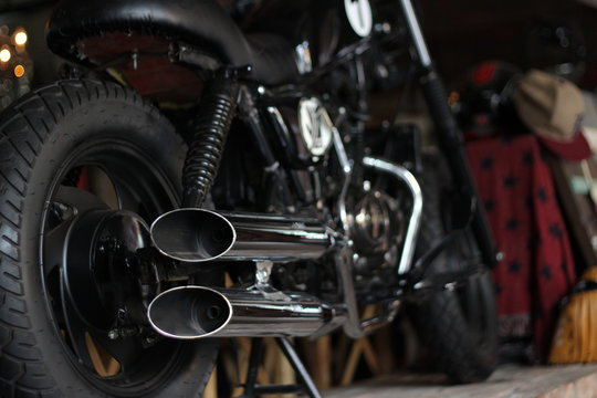 Photos of black bike motorcycle with dual chrome exhaust pipe