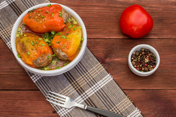 Stuffed pepper. Wooden background. Top view