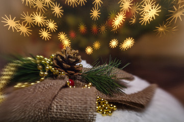 Composition from decorative items for New Year or Christmas with bokeh lights in the background.
