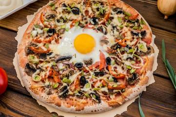 Vegetarian pizza. Old background. Close-up