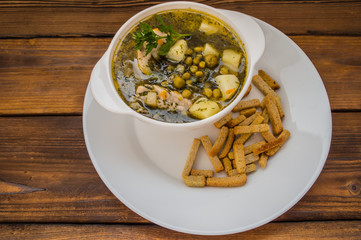 Pea soup on a wooden oak background. Top view. Close-up