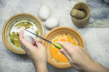 Obraz na płótnie Canvas Egg white and egg yolk in two bowls. 