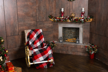 Rocking chair with a blanket in the living room with decorated m
