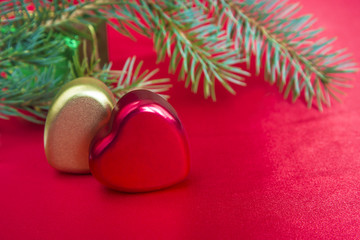 holidays concept/two hearts on scarlet satin background