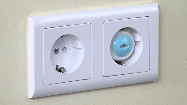Hand remove safety plug from electricity outlet and insert charger