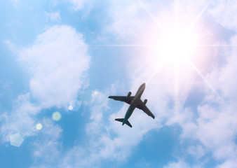 Fototapeta na wymiar Airplane in the sky and cloud at sunrise