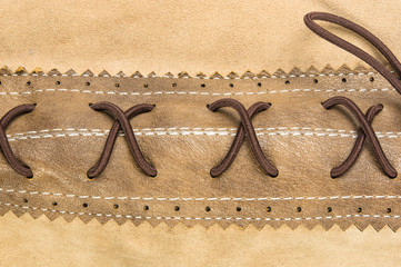 seams on leather hand bag