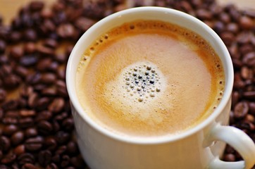 Cup of coffee and coffee beans.