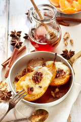 Baked pears with honey stuffed with gorgonzola cheese and walnuts