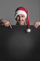 Man in Santa hat with banner