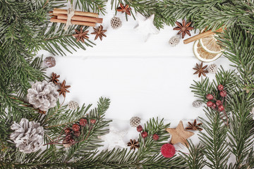 Obraz na płótnie Canvas Christmas decoration of fir tree on wood background, top view. C