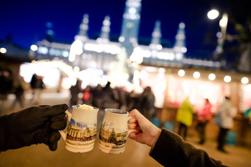 People holding traditional Punch cups in Vienna Christmas Market, December 2016