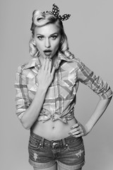 Fototapeta premium young surprised woman, dressed in pin-up style