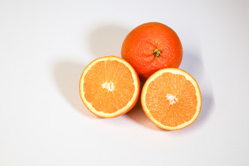 Oranges on a white surface