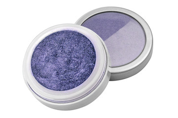 Blue color eyeshadow powder with glitter particles, in round grey open container sitting on its lid, beauty product isolated on white background