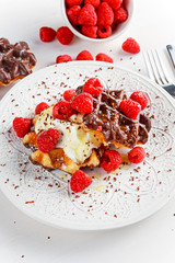 Belgian chocolate waffles with fresh raspberries, whipped cream and honey syrup