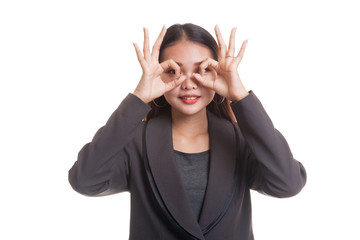 Asian business woman do funny  double OK sign as glasses.