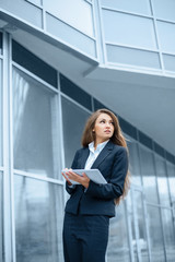 Fototapeta premium Successful businesswoman or entrepreneur using a digital tablet