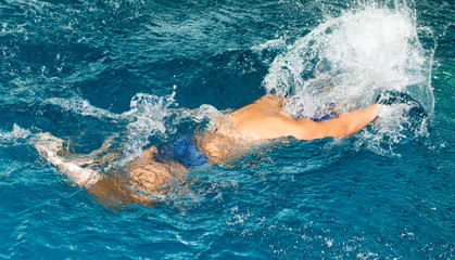 boy swimming in the pool
