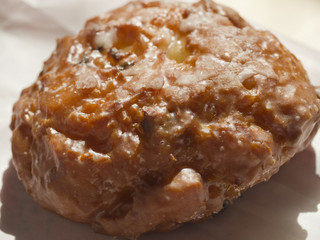 An apple fritter, a popular American sweet