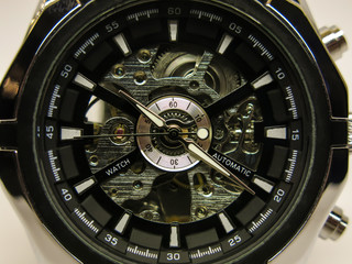 hand-operated mechanical chrome watch with black dial